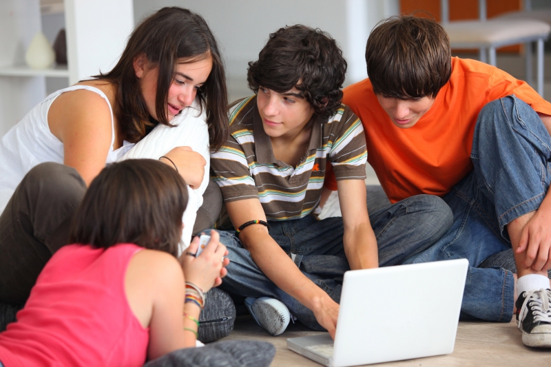 2821024-teenagers-looking-at-a-computer-screen